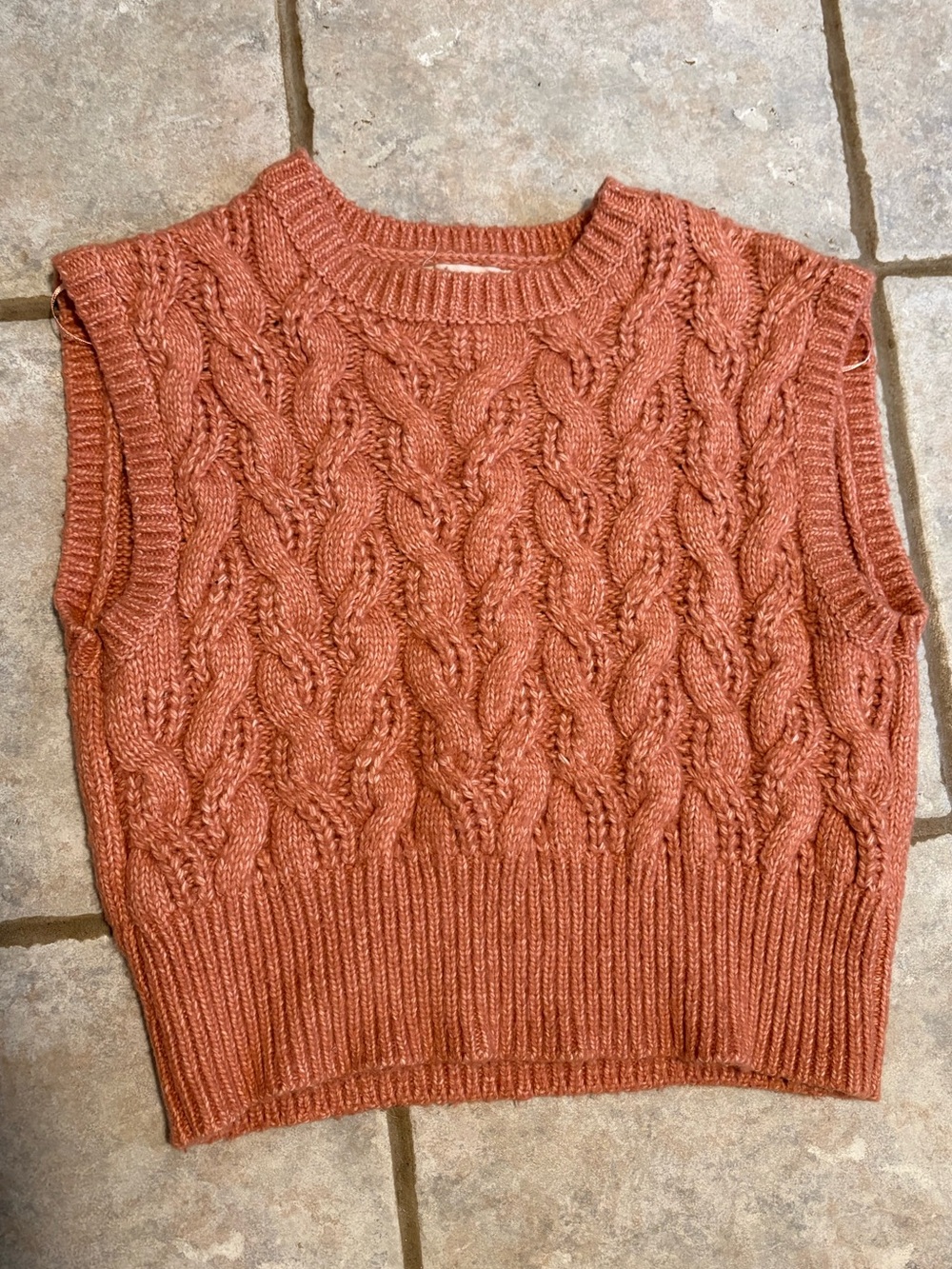 Orange knit sweater vest
